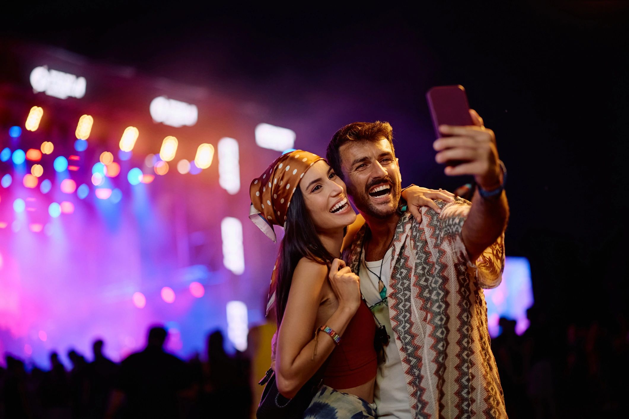 happy fans at concert technology